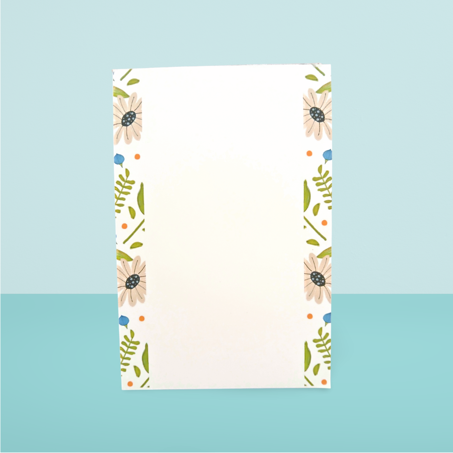 Floral patterned paper with a blue background