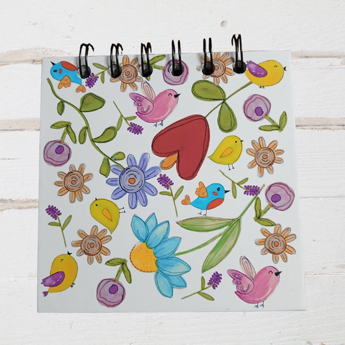 Colorful illustration of birds, flowers, and a heart on a white background