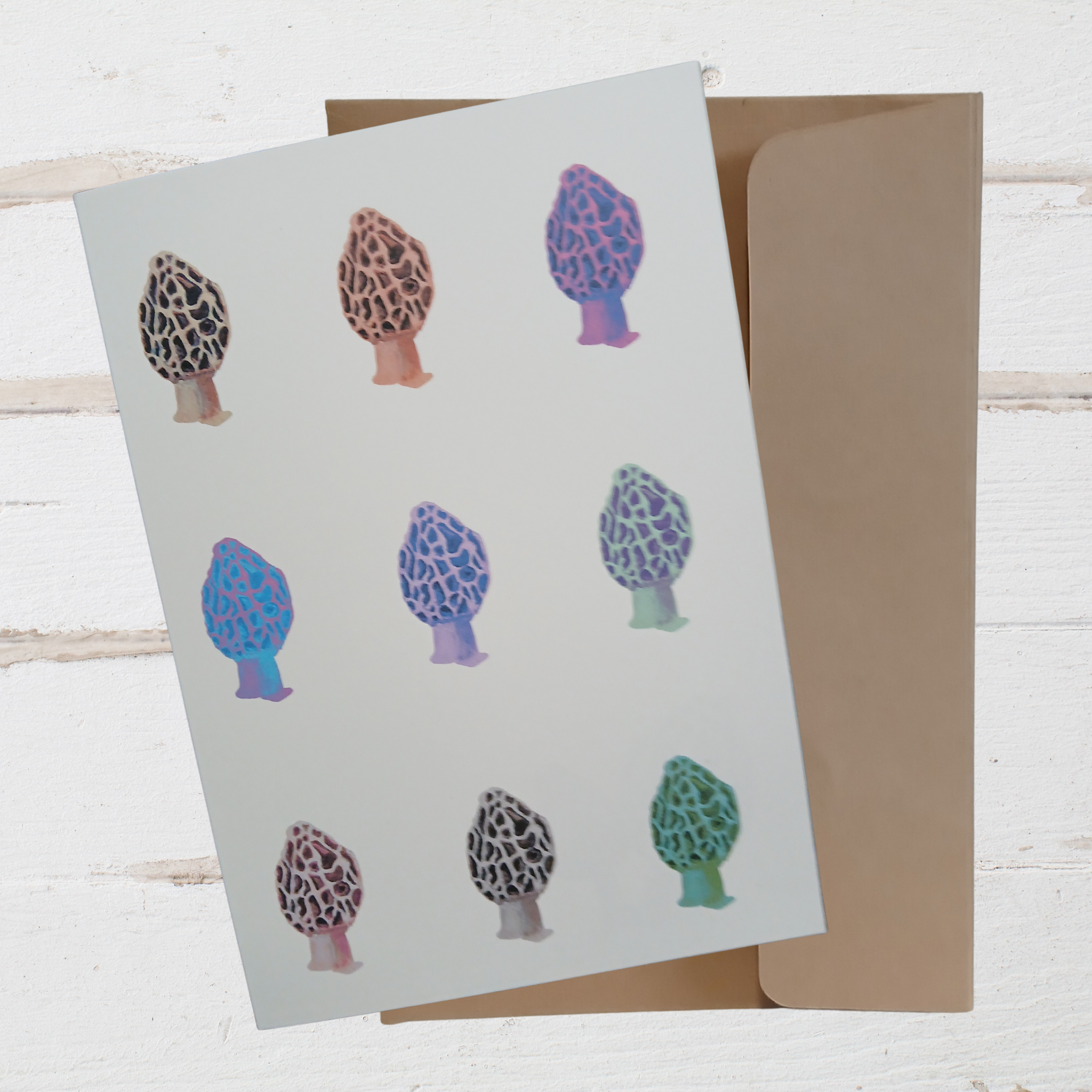 card with mushroom illustrations on a wooden surface