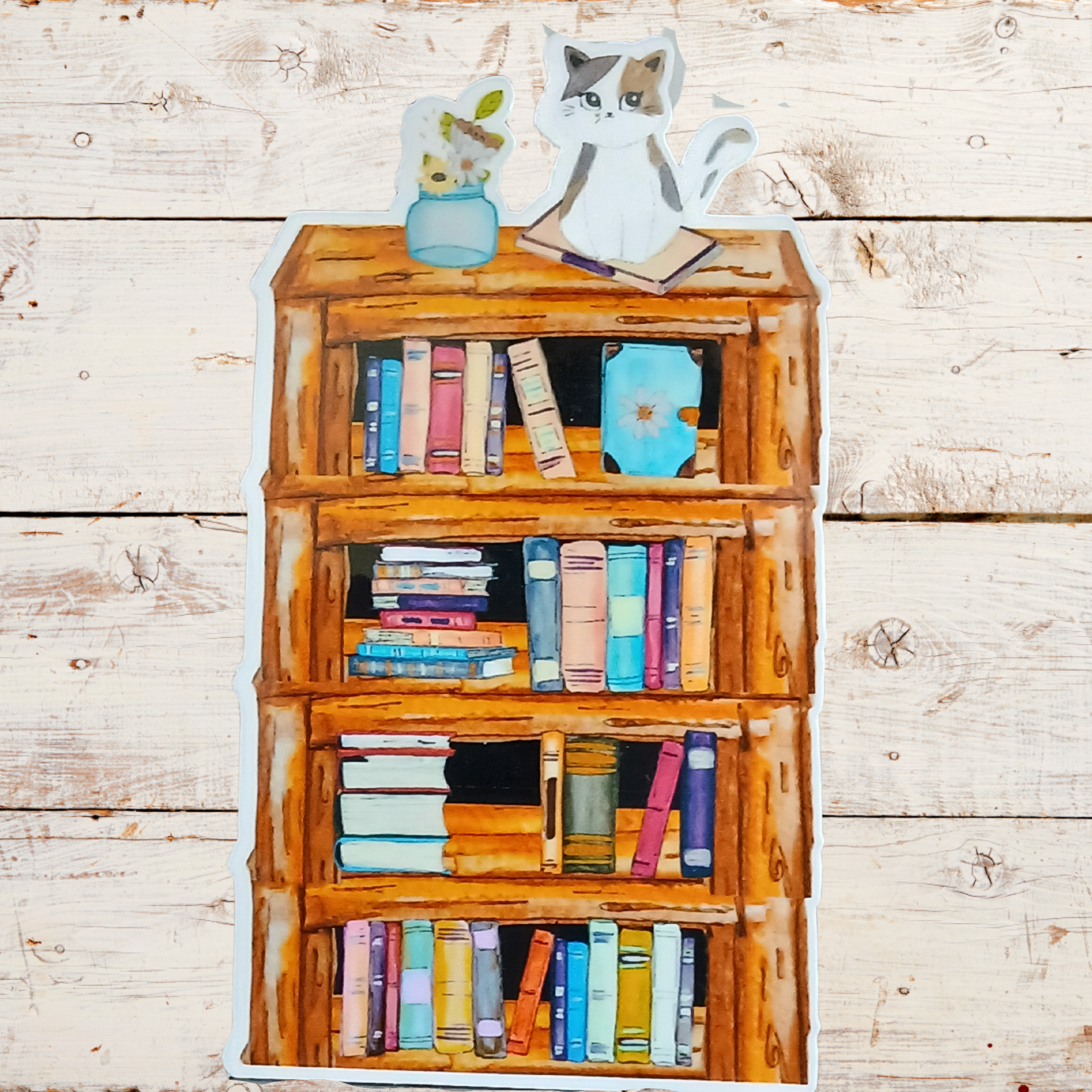 Wooden bookshelf with books and decorative items on a wooden surface