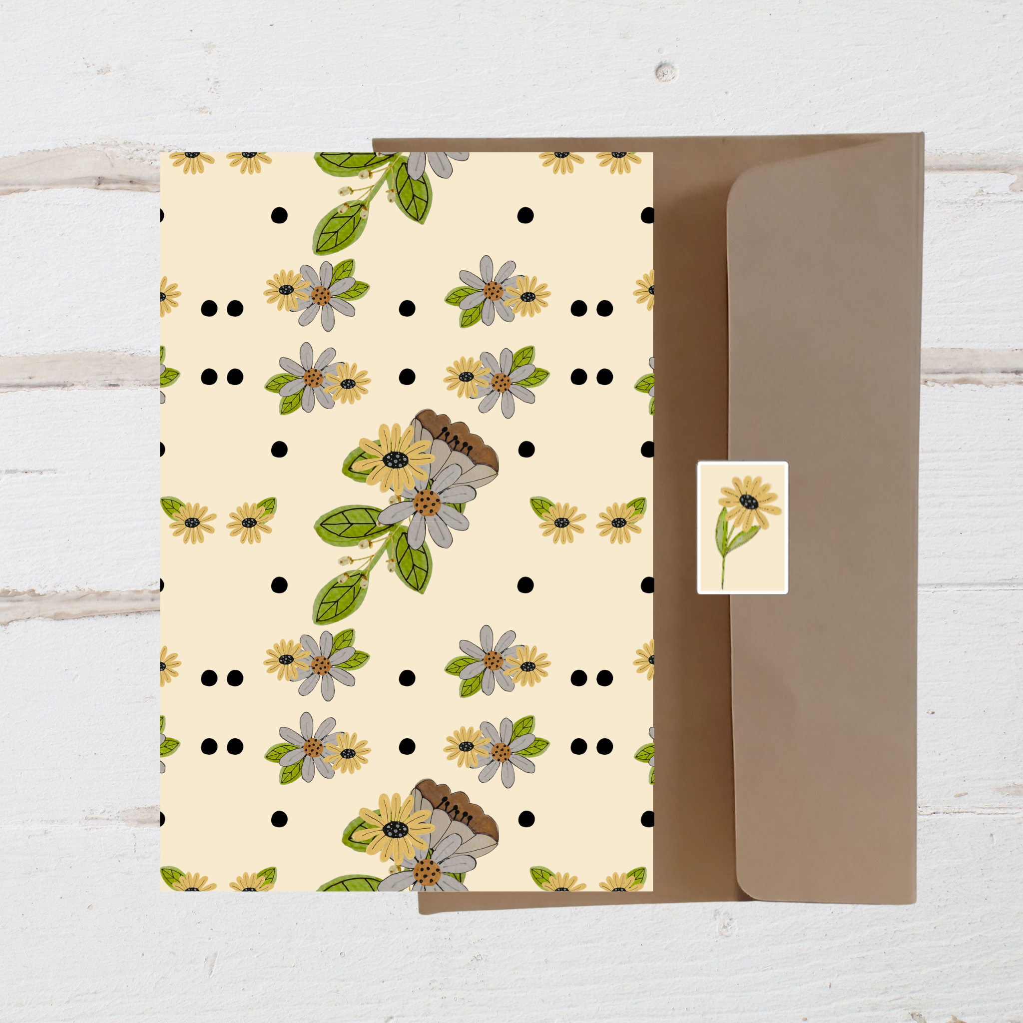 Floral patterned card with a matching envelope on a wooden surface