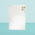 Notepad with floral design on a light blue background