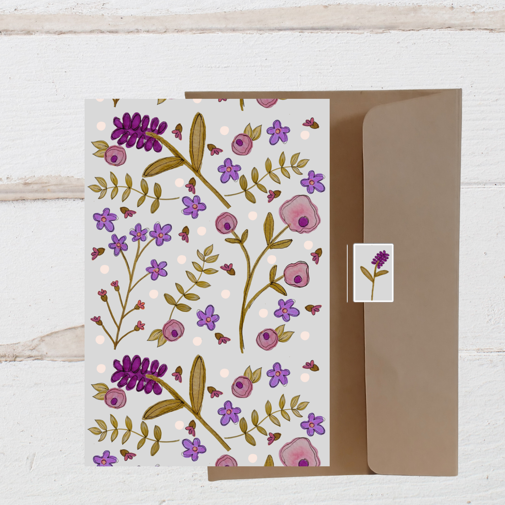 Floral card with a matching envelope on a wooden surface