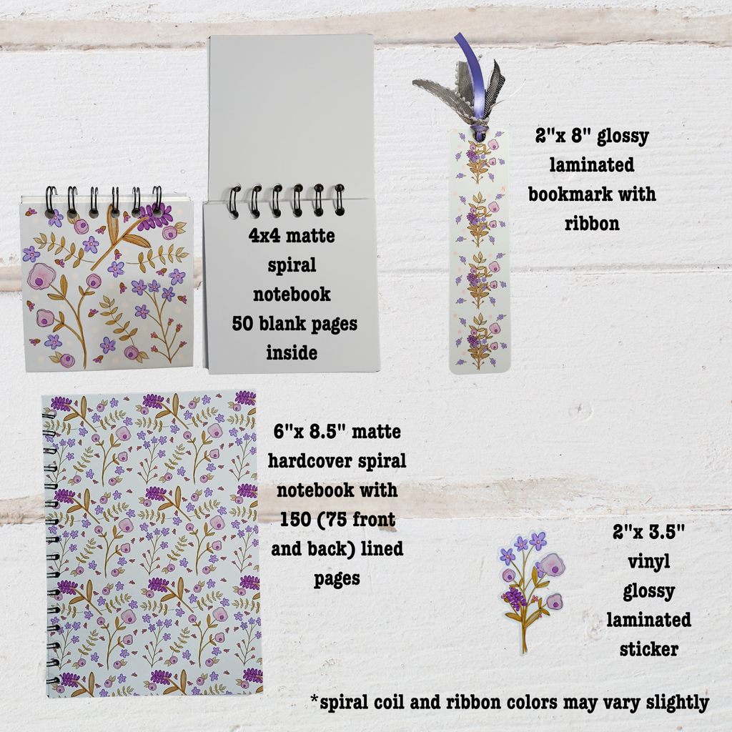 Set of stationery items including  4"x 4" and 6"x 8.5" notebooks and 2"x 8"bookmark with floral designs on a wooden surface.