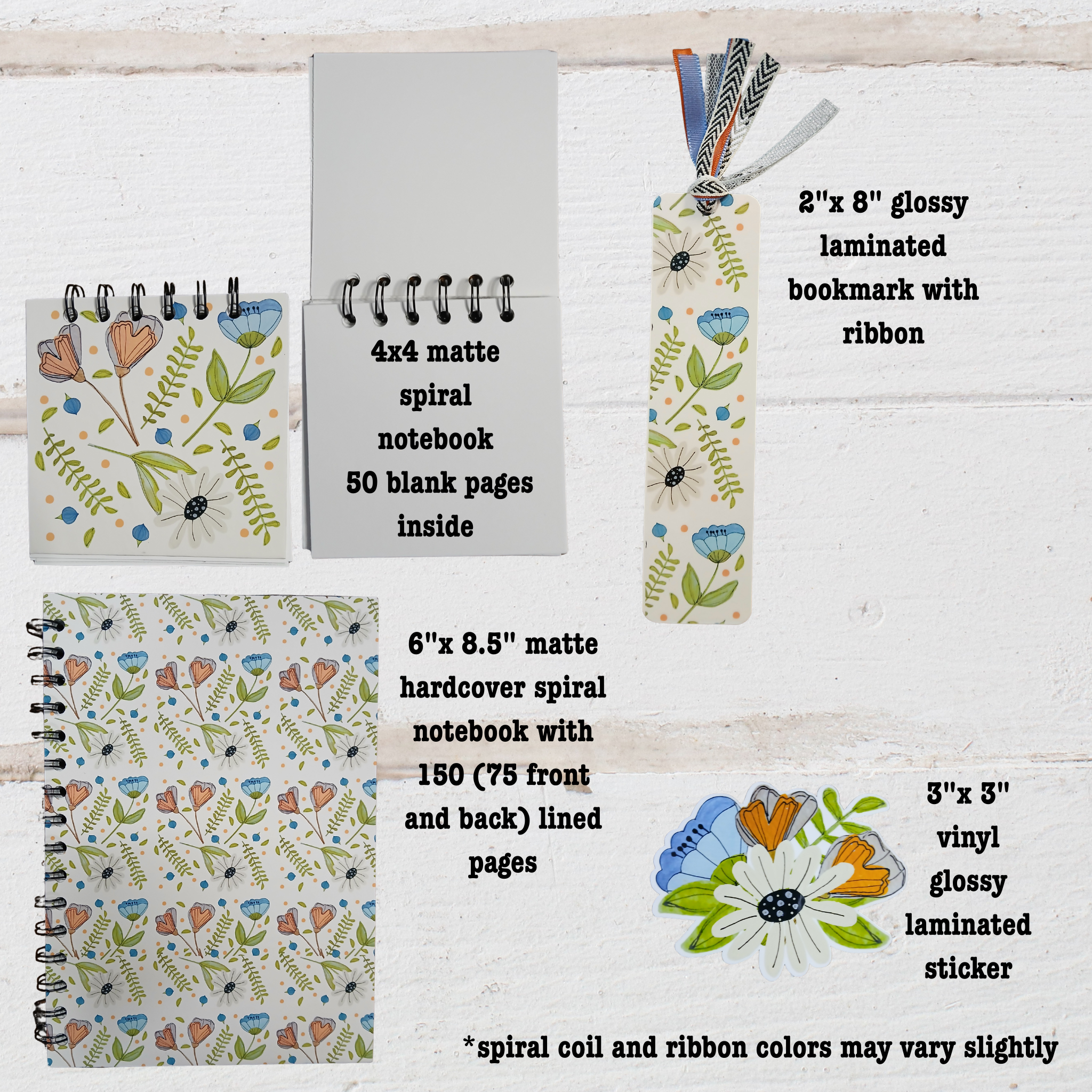 Set of stationery items including  4"x 4" and 6"x 8.5" notebooks,2"x 8"  bookmark, and a sticker on a wooden surface.