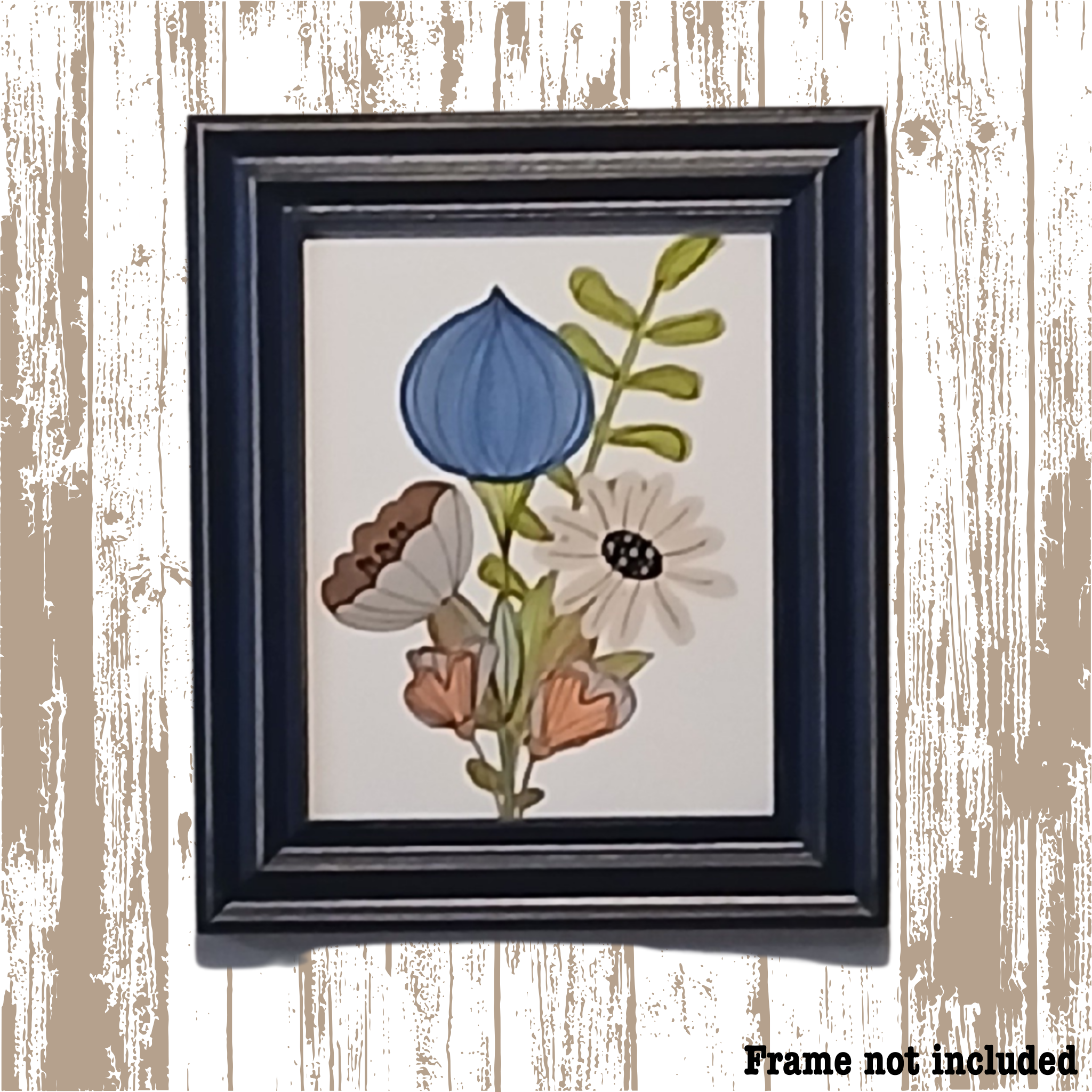 Framed botanical illustration with blue flower on a wooden surface