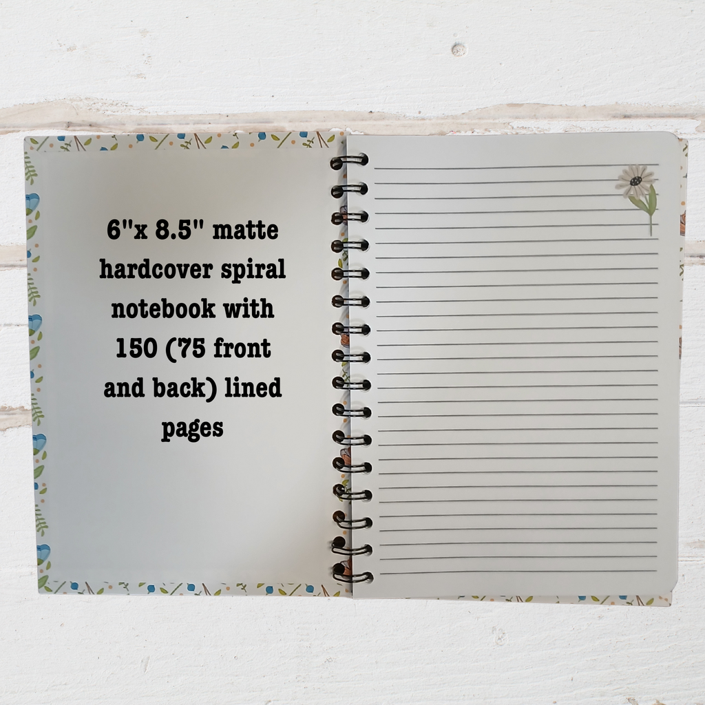 Open notebook showing lined pages with text  6"x 8.5" notebook.