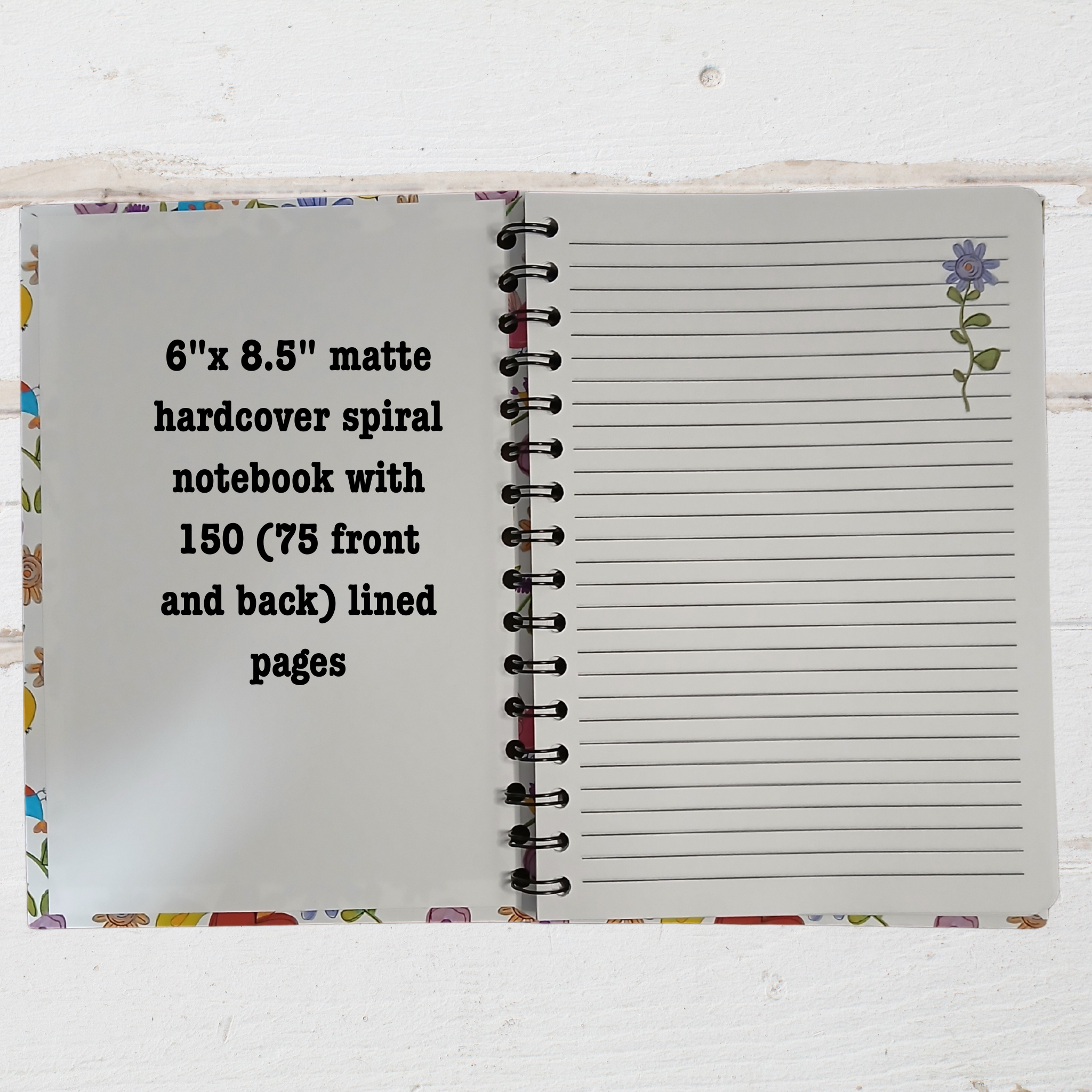 Open notebook showing lined pages with text 6" x8.5" notebook.