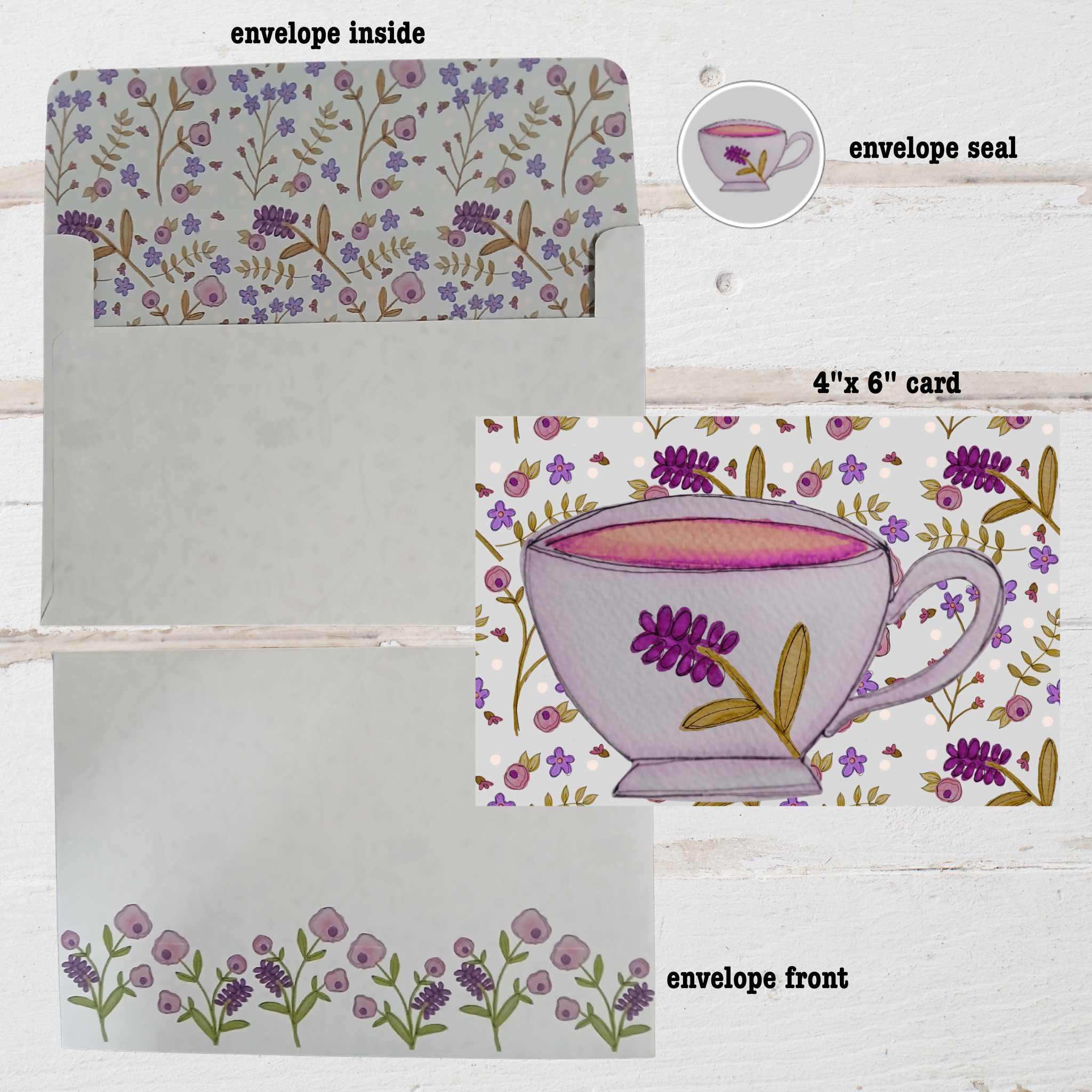 Set of stationery items with floral design and teacup illustration on a wooden surface.